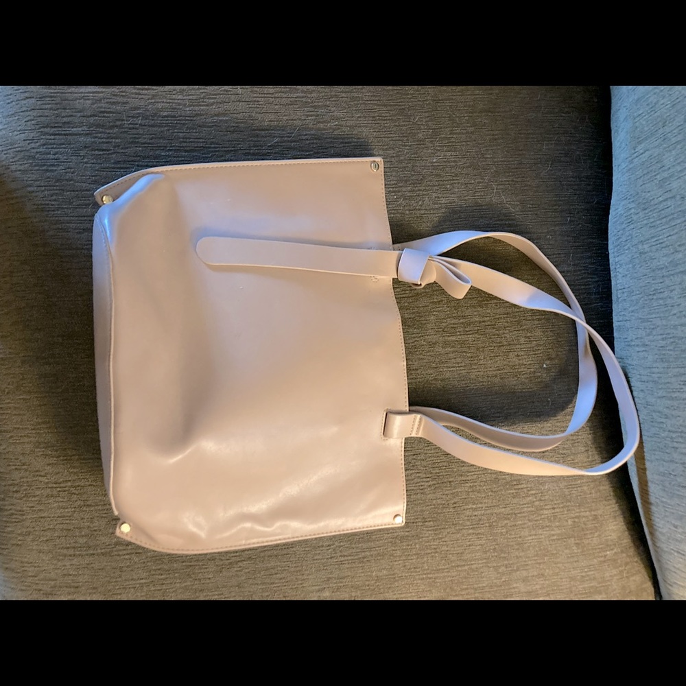 Very light blush color generic med bag. Comfy & light weight.